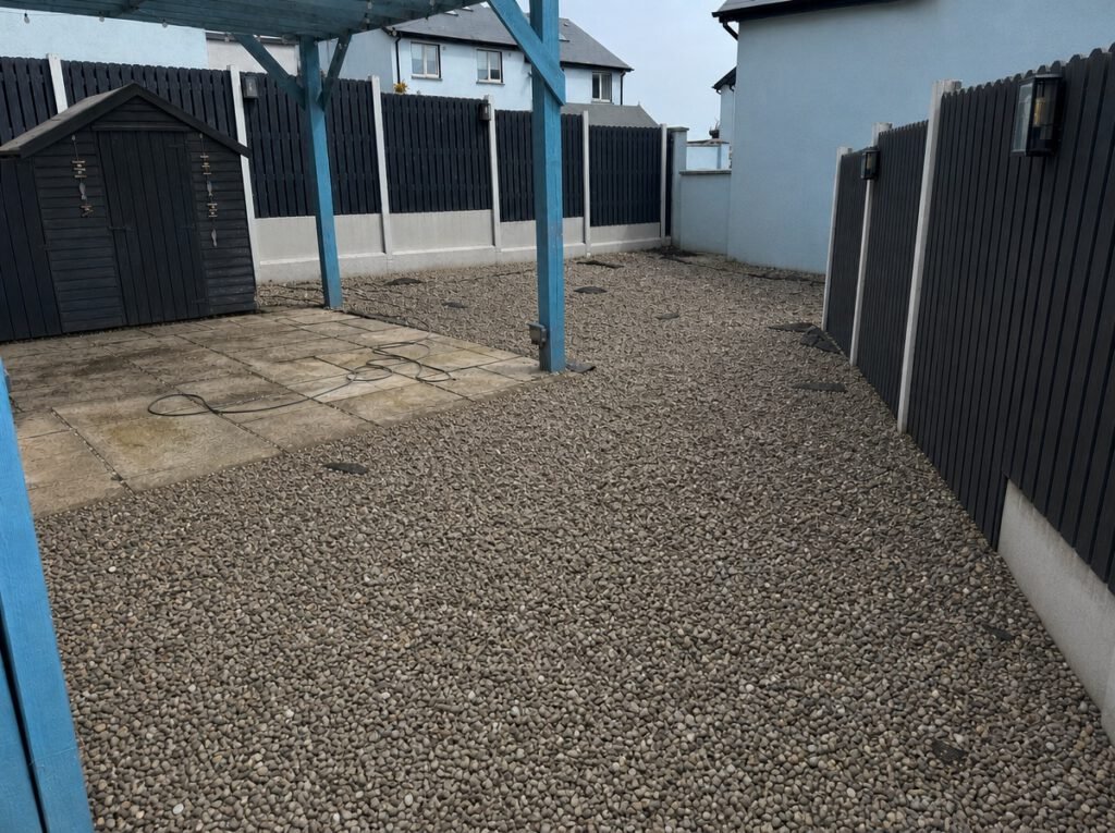 Before — gravel garden with a worn patio in Skerries